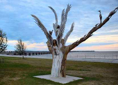 The Angel Tree. Nikki and her friends commissioned an artist to carve an angel into the tree that saved their lives.